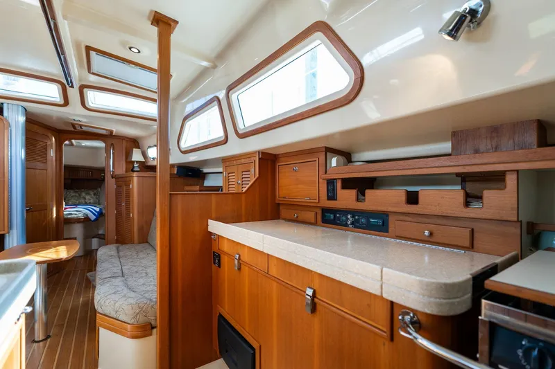 Easy Going Yacht Photos Pics Luxurious 2008 Island Packet 465 yacht interior with wood finishes and ample natural light.