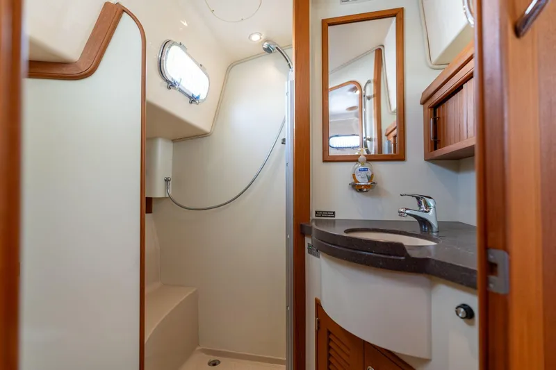 Easy Going Yacht Photos Pics Luxurious bathroom in 2008 Island Packet 465 yacht with modern fixtures and wood accents.