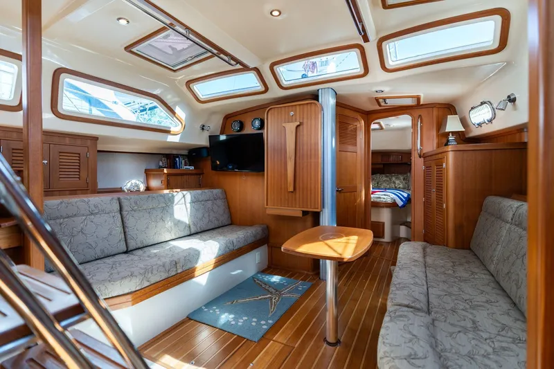 Easy Going Yacht Photos Pics Luxurious 2008 Island Packet 465 yacht interior with elegant wood finish and comfortable seating.