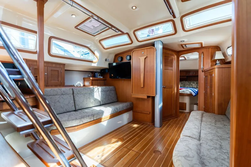 Easy Going Yacht Photos Pics Luxurious 2008 Island Packet 465 yacht interior with elegant wood finish and comfortable seating.