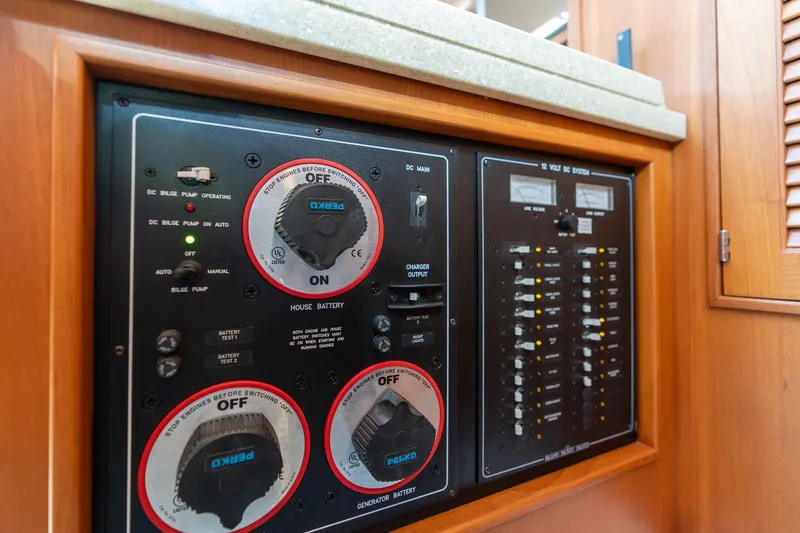 Easy Going Yacht Photos Pics Electrical control panel on a 2008 Island Packet 465 yacht, featuring battery and system switches.