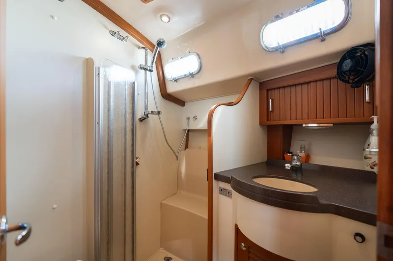 Easy Going Yacht Photos Pics Luxurious bathroom in 2008 Island Packet 465 yacht with shower and wooden cabinetry.