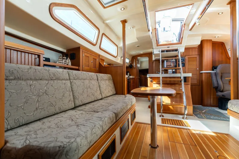 Easy Going Yacht Photos Pics Luxurious interior of 2008 Island Packet 465 yacht with elegant wood finishes and comfortable seating.