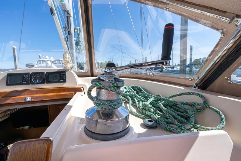 Easy Going Yacht Photos Pics 2008 Island Packet 465 sailboat cockpit with winch and ropes, marina view.