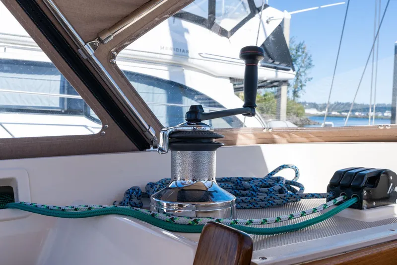 Easy Going Yacht Photos Pics Sailboat winch and ropes on 2008 Island Packet 465, docked with scenic background.