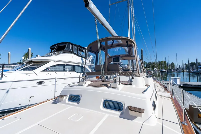 Easy Going Yacht Photos Pics 2008 Island Packet 465 yacht docked at marina under clear blue sky.