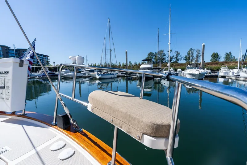 Easy Going Yacht Photos Pics 2008 Island Packet 465 sailboat docked in a serene marina under clear blue skies.