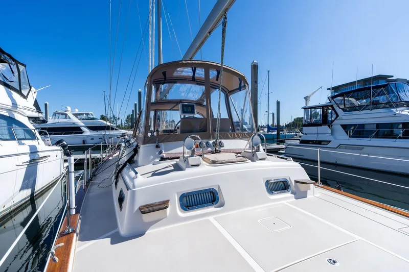 Easy Going Yacht Photos Pics 2008 Island Packet 465 yacht docked at marina under clear blue sky.