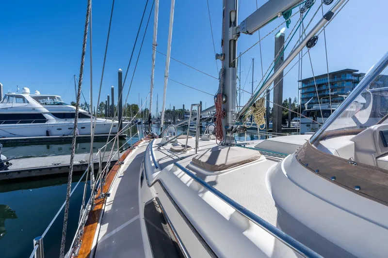 Easy Going Yacht Photos Pics 2008 Island Packet 465 sailboat docked in marina under clear blue sky.