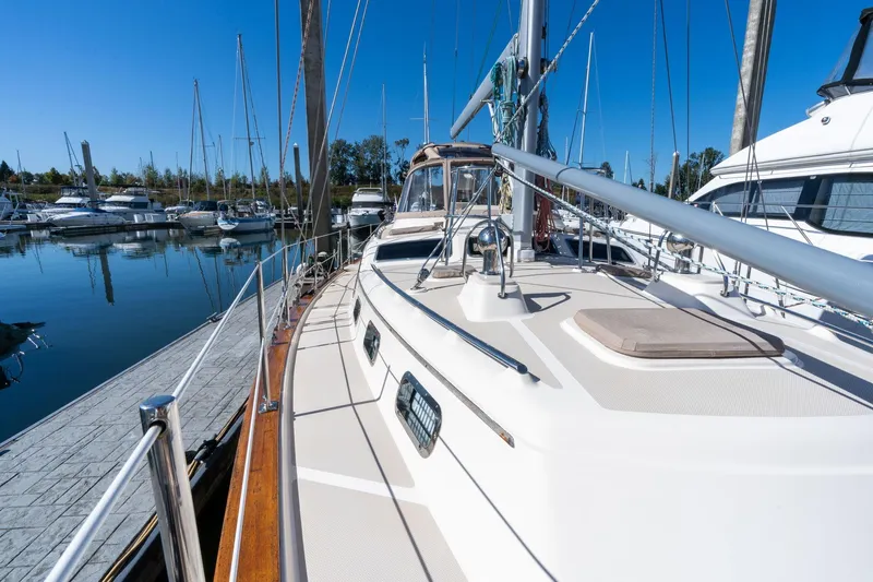 Easy Going Yacht Photos Pics 2008 Island Packet 465 sailboat docked in a marina under clear blue skies.