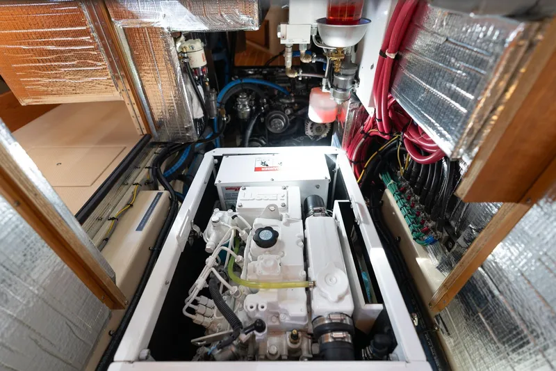 Easy Going Yacht Photos Pics Engine room of 2008 Island Packet 465 yacht, showcasing mechanical components and wiring.