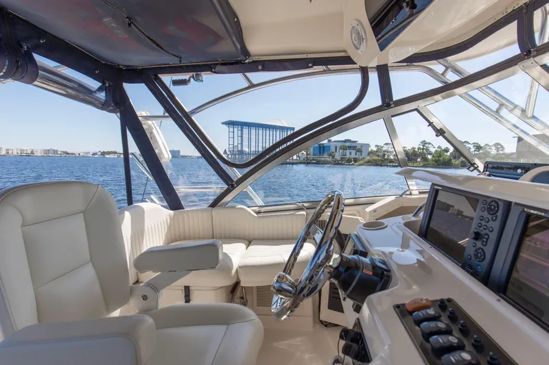  Yacht Photos Pics Interior view of 2009 Grady-White 330 Express boat with luxurious seating and navigation equipment.
