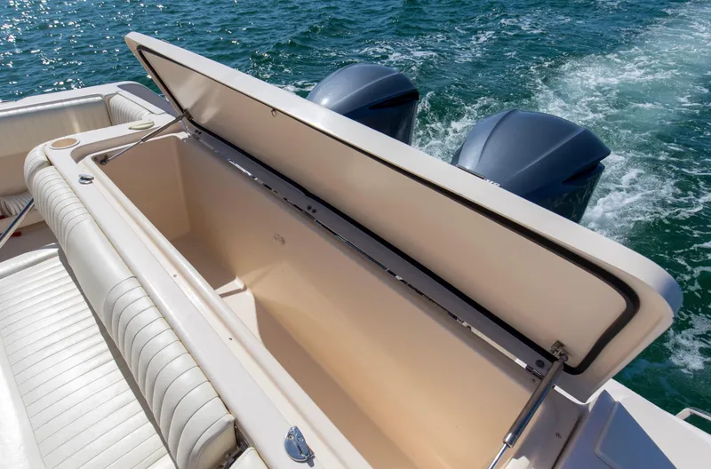  Yacht Photos Pics Open storage compartment on 2009 Grady-White 330 Express boat with twin engines.