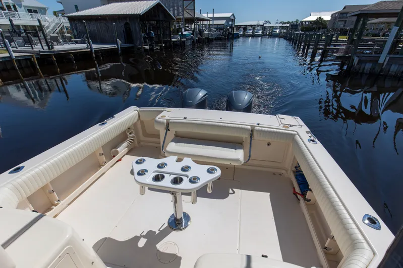  Yacht Photos Pics 2009 Grady-White 330 Express boat with spacious deck and dual outboard motors.