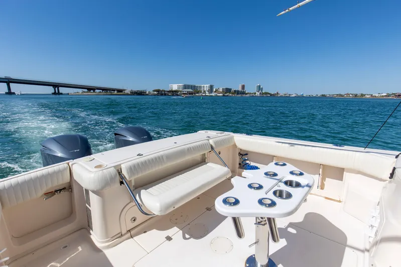  Yacht Photos Pics 2009 Grady-White 330 Express boat on water, featuring spacious deck and dual engines.