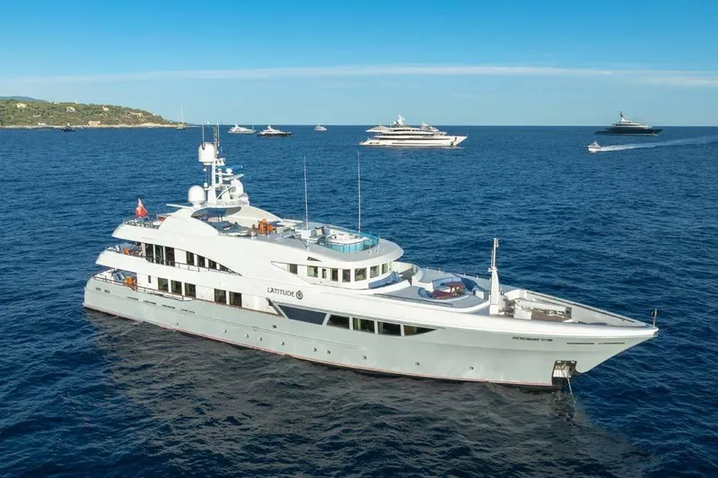 Latitude Yacht Photos Pics Luxurious 2009 Timmerman Expedition Tri-Deck yacht cruising in open sea.