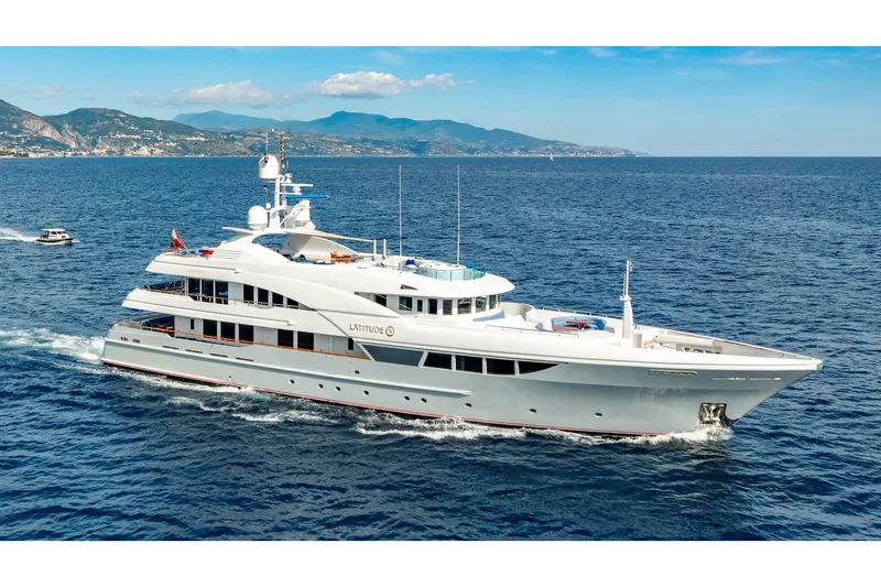 Latitude Yacht Photos Pics Luxurious 2009 Timmerman Expedition Tri-Deck yacht cruising on open sea.