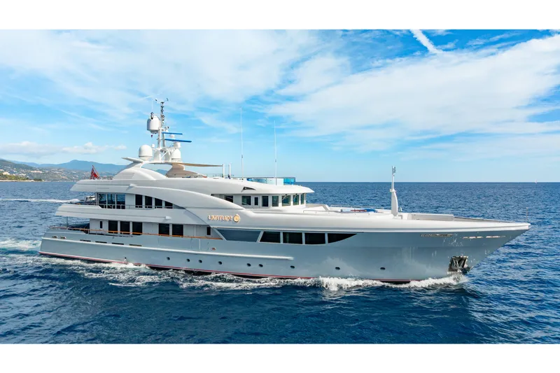 Latitude Yacht Photos Pics Luxurious 2009 Timmerman Expedition Tri-Deck yacht cruising on open sea.