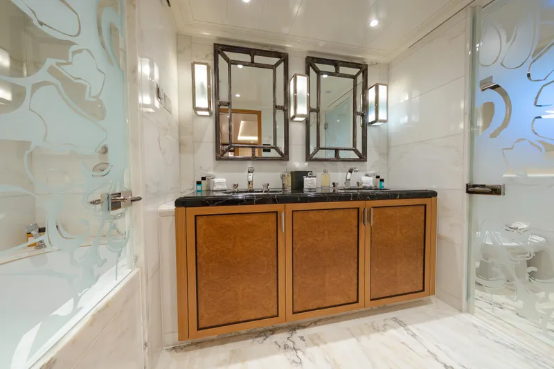 Latitude Yacht Photos Pics Luxurious bathroom on 2009 Timmerman Expedition Tri-Deck yacht with elegant double vanity.