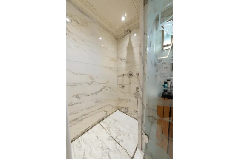 Latitude Yacht Photos Pics Luxurious marble shower in 2009 Timmerman Expedition Tri-Deck yacht bathroom.