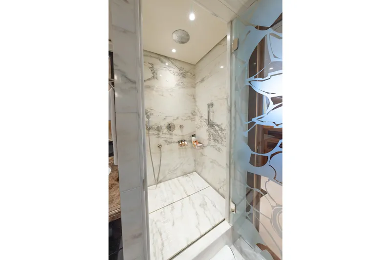 Latitude Yacht Photos Pics Luxurious marble shower in 2009 Timmerman Expedition Tri-Deck yacht bathroom.