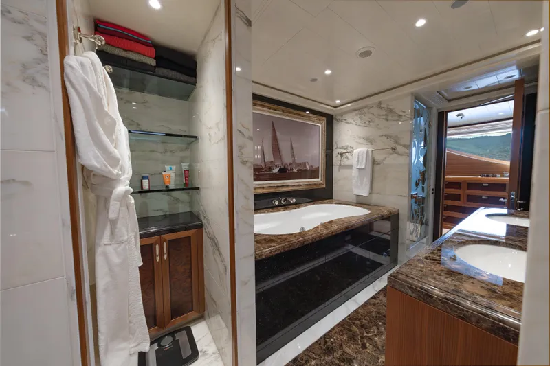 Latitude Yacht Photos Pics Luxurious bathroom on 2009 Timmerman Expedition Tri-Deck yacht with marble finishes and elegant decor.