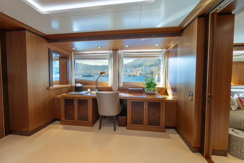 Latitude Yacht Photos Pics Luxurious interior of 2009 Timmerman Expedition Tri-Deck yacht with elegant wood finish and scenic window view.