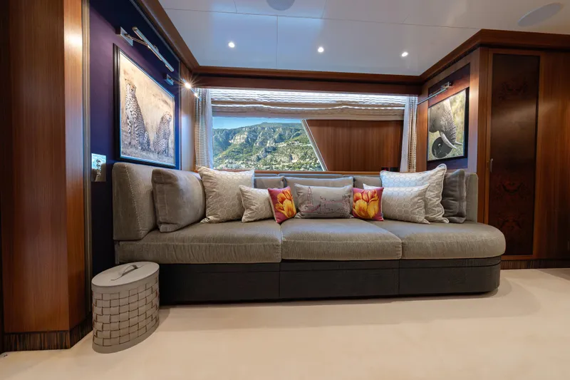 Latitude Yacht Photos Pics Luxurious interior of 2009 Timmerman Expedition Tri-Deck yacht with elegant sofa and scenic window view.