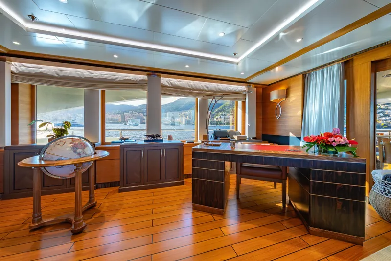 Latitude Yacht Photos Pics Luxurious interior of 2009 Timmerman Expedition Tri-Deck yacht with elegant wood finishes and scenic views.