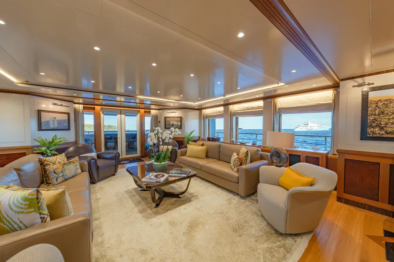 Latitude Yacht Photos Pics Luxurious interior of 2009 Timmerman Expedition Tri-Deck yacht with elegant seating and ocean view.