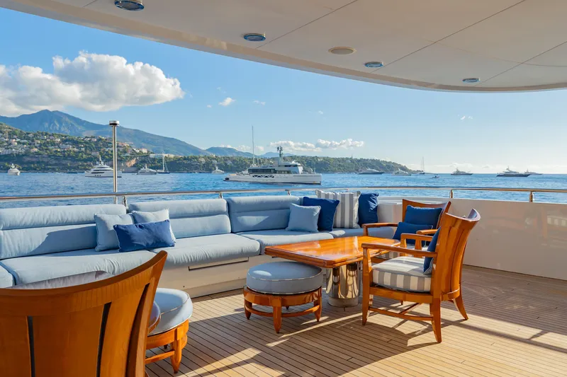 Latitude Yacht Photos Pics Luxurious deck of 2009 Timmerman Expedition Tri-Deck yacht with ocean view and seating.