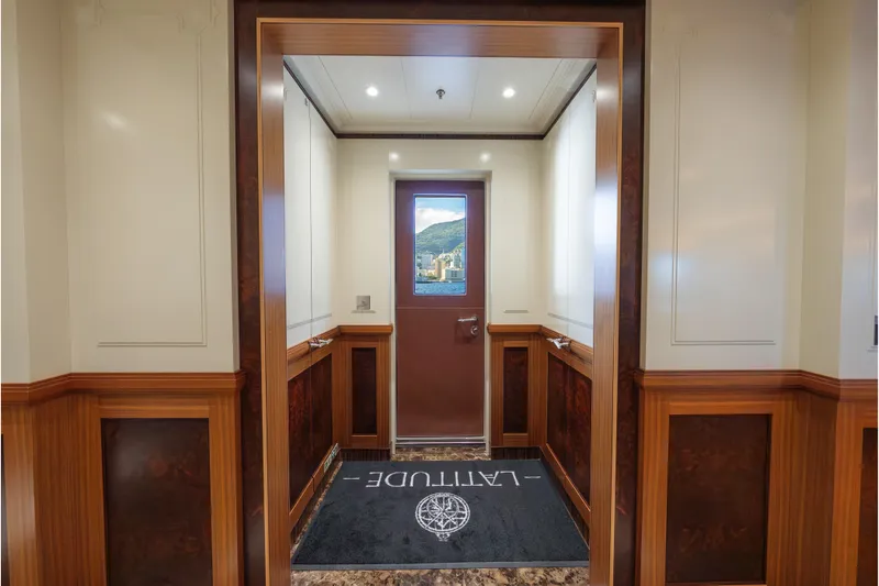 Latitude Yacht Photos Pics Luxurious interior of 2009 Timmerman Expedition Tri-Deck yacht with elegant wood paneling.