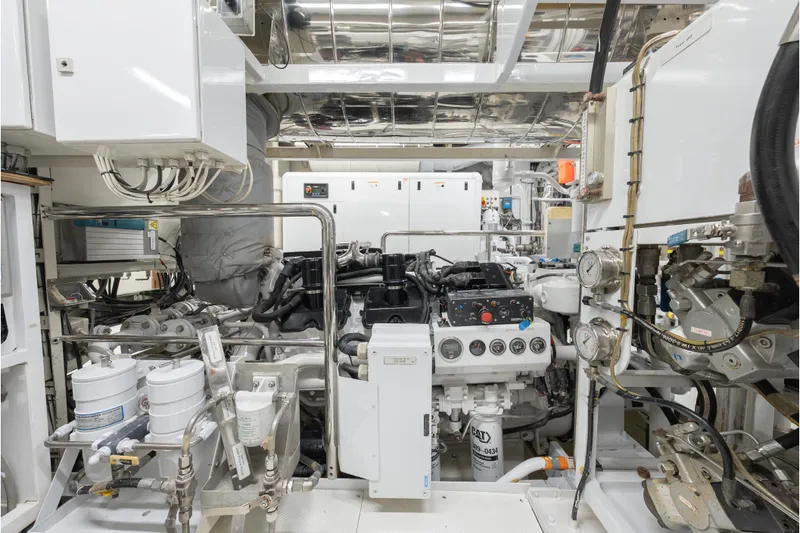 Latitude Yacht Photos Pics Engine room of 2009 Timmerman Expedition Tri-Deck yacht, showcasing complex machinery and controls.