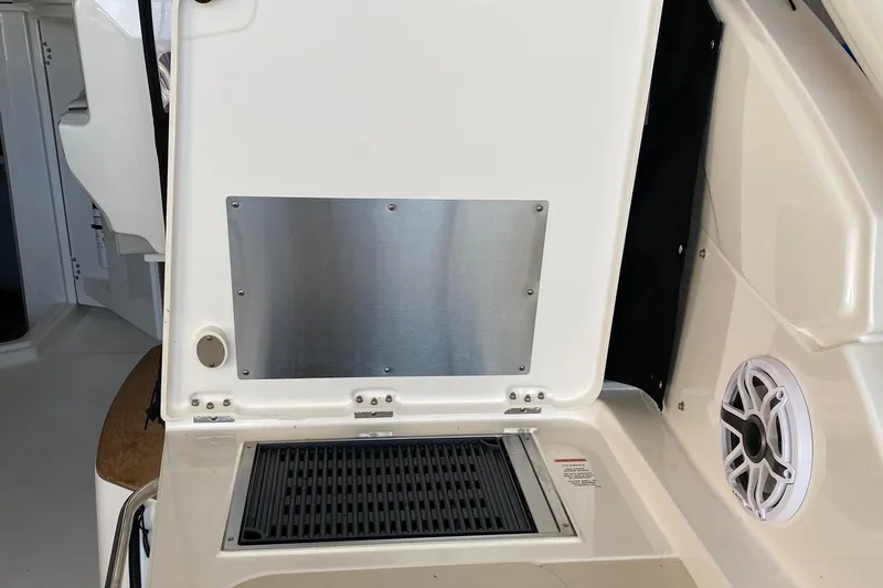  Yacht Photos Pics 2022 Pursuit DC 365 boat interior with stainless steel panel and speaker.