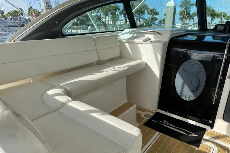 Brown Eyed Girl Yacht Photos Pics 2004 Pursuit 3800 Express boat interior with white seating and nautical decor.