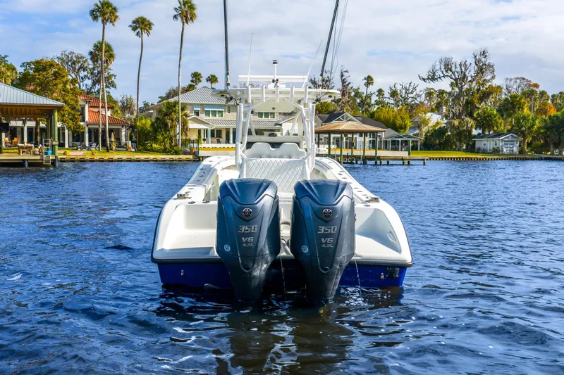  Yacht Photos Pics 2014 Yellowfin 32 Offshore boat with dual 350 V6 engines on a scenic waterfront.