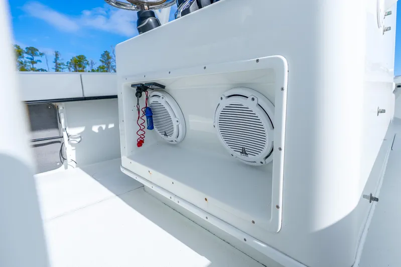  Yacht Photos Pics 2014 Yellowfin 32 Offshore boat interior with speakers and control panel.