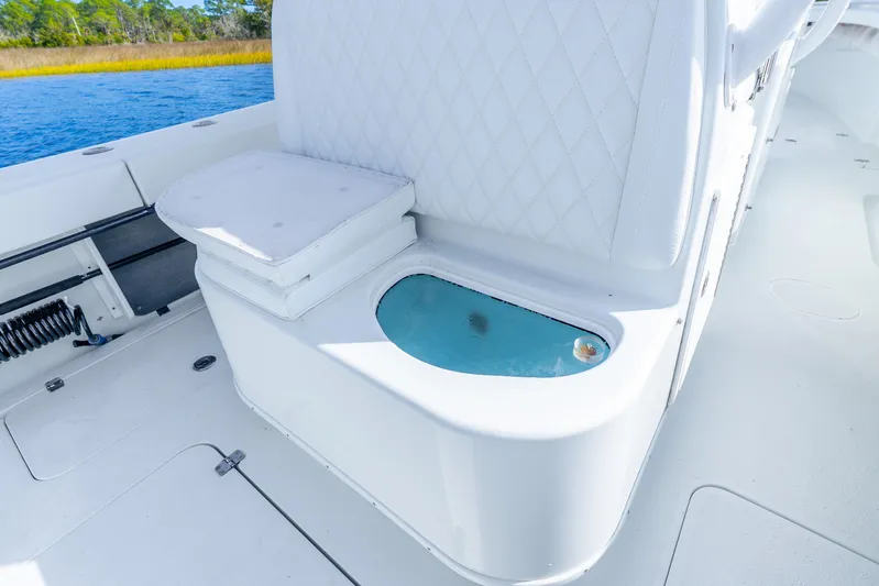  Yacht Photos Pics 2014 Yellowfin 32 Offshore boat interior with cushioned seating and livewell.