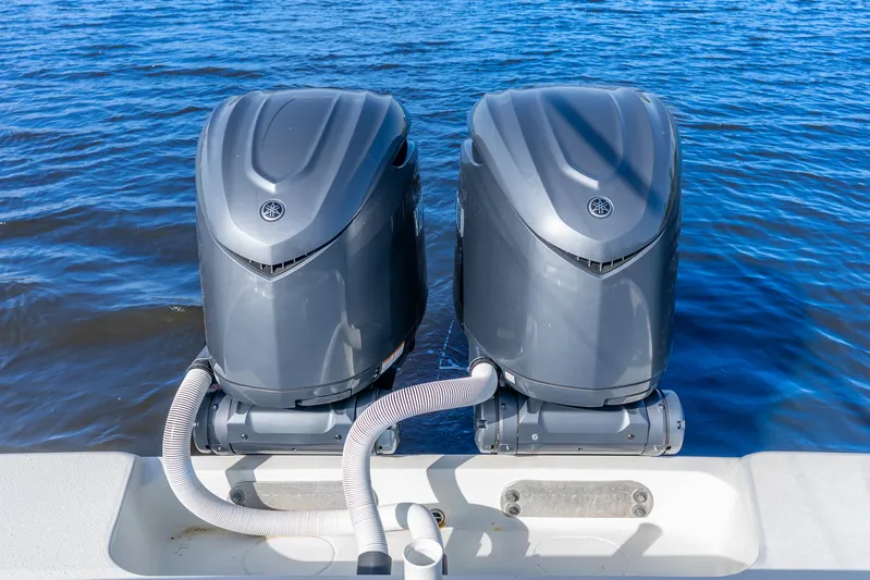  Yacht Photos Pics Twin outboard motors on a 2014 Yellowfin 32 Offshore boat in blue water.