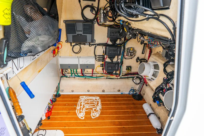  Yacht Photos Pics Electrical system inside a 2014 Yellowfin 32 Offshore boat, showcasing wiring and components.