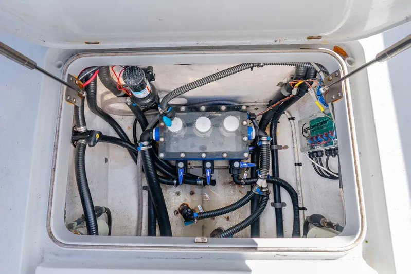  Yacht Photos Pics 2014 Yellowfin 32 Offshore boat compartment with wiring and plumbing components.