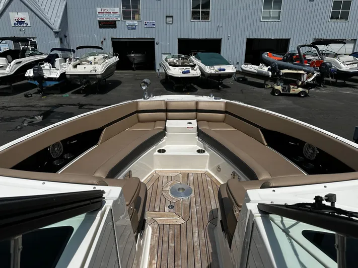 Nereids Yacht Photos Pics 2018 Sea Ray SLX 350 boat interior with spacious seating at a marina.