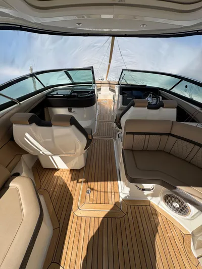 Nereids Yacht Photos Pics 2018 Sea Ray SLX 350 boat interior with luxurious seating and wood flooring.