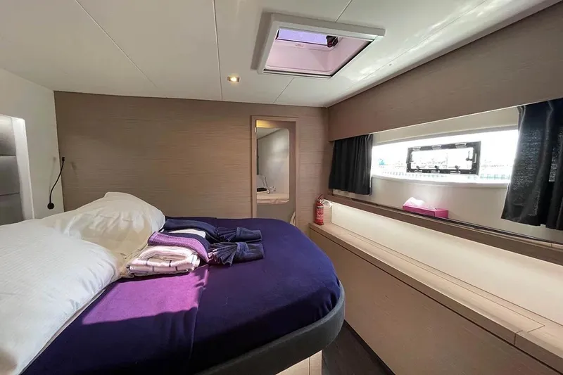 Knotty Cat Yacht Photos Pics Luxurious cabin interior of 2022 Fountaine Pajot Tanna 47 yacht with modern design.