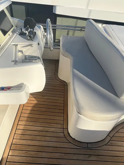  Yacht Photos Pics Luxurious Ferretti Yachts 620 cockpit with wooden flooring and plush seating, 2000 model.