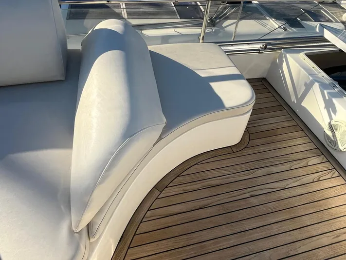  Yacht Photos Pics Luxurious seating on 2000 Ferretti Yachts 620 with elegant wooden deck.