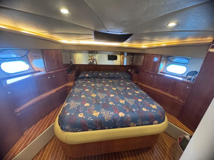  Yacht Photos Pics Luxurious cabin interior of 2000 Ferretti Yachts 620 with elegant wood finish.