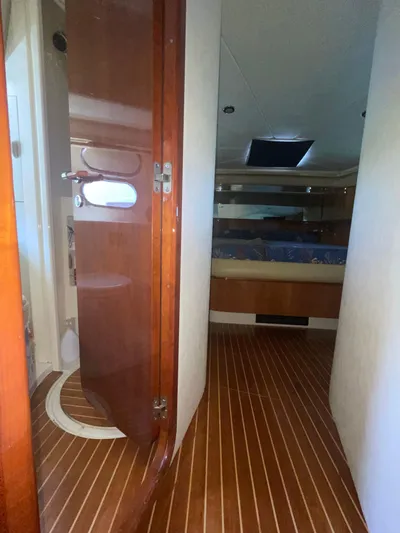  Yacht Photos Pics Interior view of 2000 Ferretti Yachts 620, featuring wooden flooring and cabin entrance.