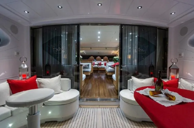  Yacht Photos Pics Luxurious interior of a 2004 Mangusta 108 yacht with elegant seating and ambient lighting.