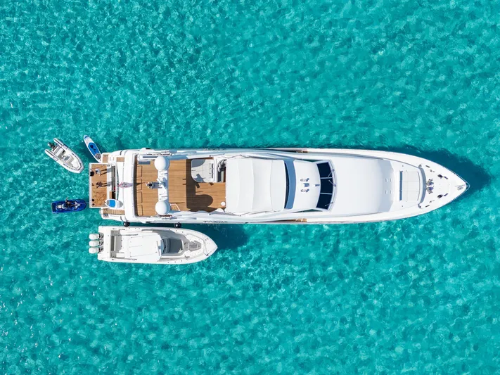 Mambo Yacht Photos Pics Aerial view of 2004 Ferretti Yachts 112 Custom Line on turquoise water.
